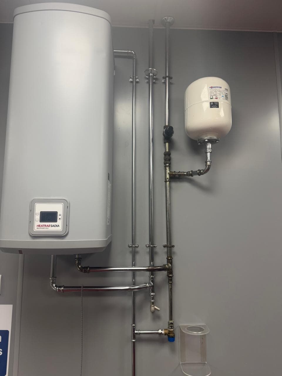 Domestic water heater and pipework installation
