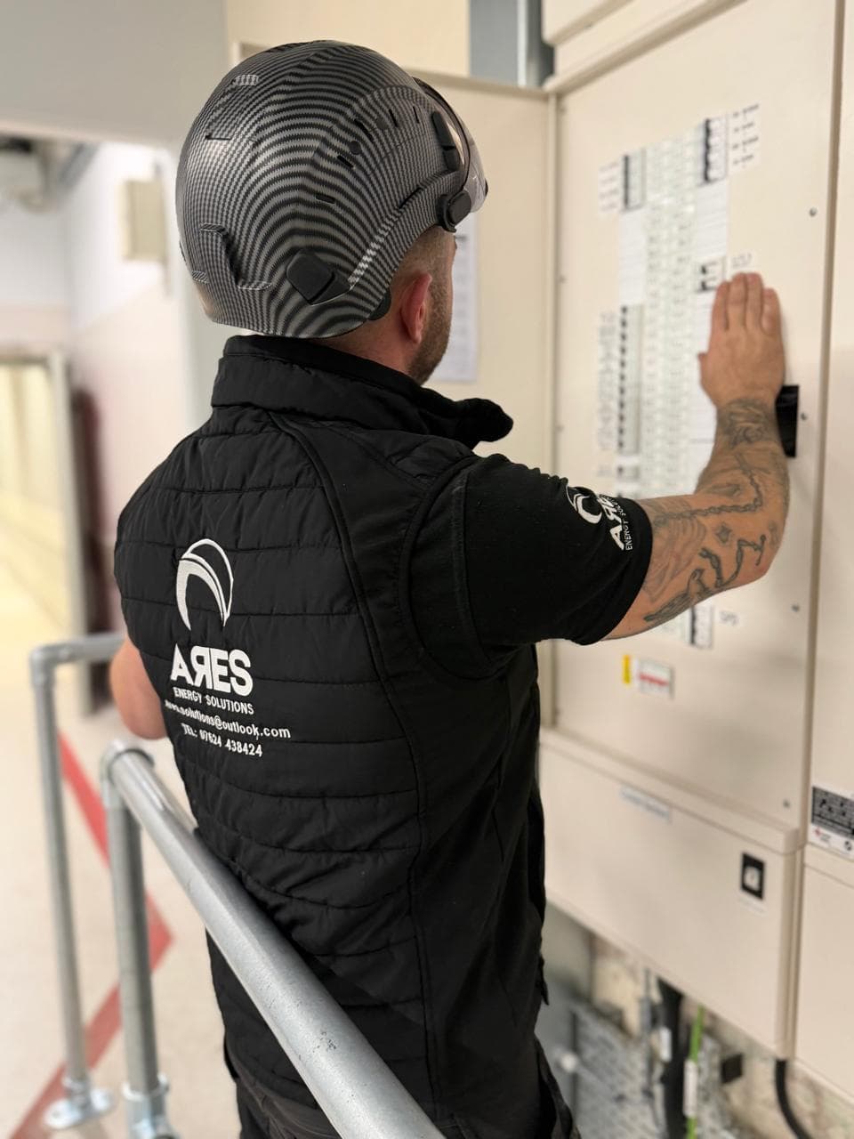 Ares technician working at a distribution board